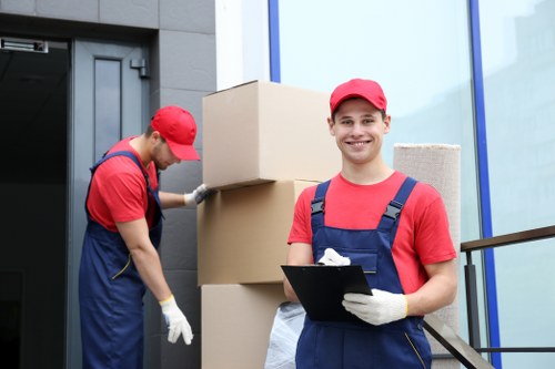 Professional furniture removals team handling items in Pimlico street access