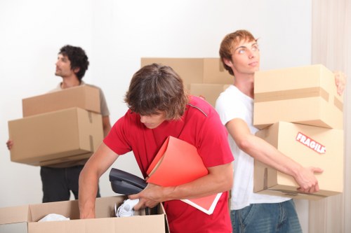 Packed office boxes and furniture ready for transport