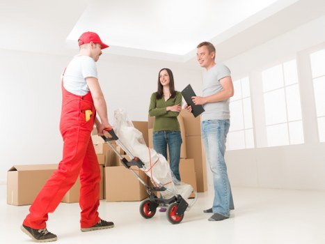 Man and van vehicle with moving boxes during a booked service