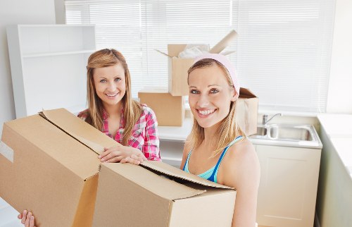 Professional movers handling furniture during a Pimlico house removal