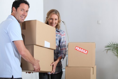 Packed moving boxes and furniture ready for transport in Pimlico